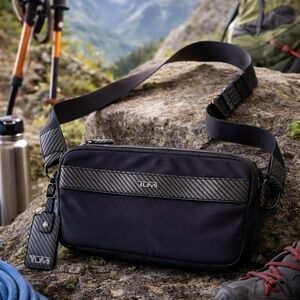TUMI Luxury Sling Bag – Black Nylon with Carbon Fiber Accents